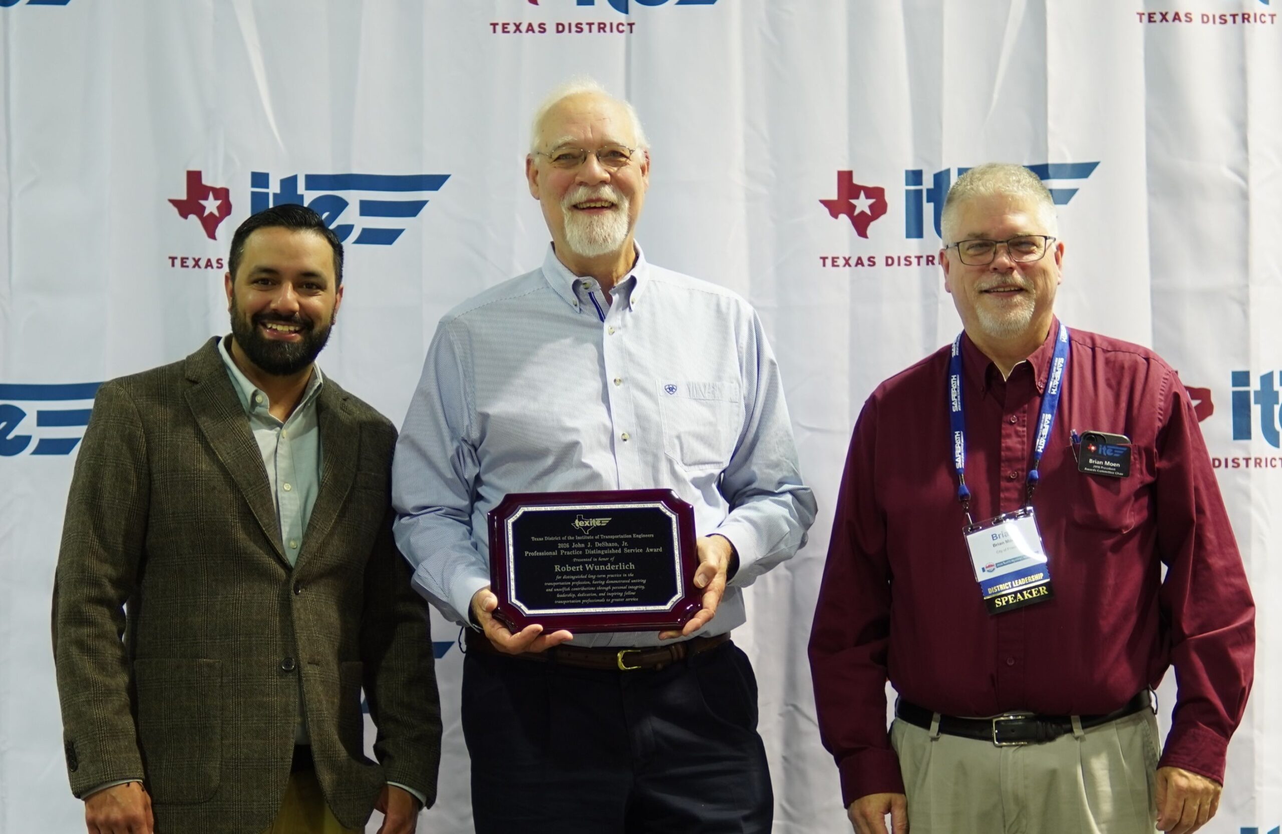 Photograph of Larry Picasso, Robert Wunderlich, and Brian Moen at the award presentation