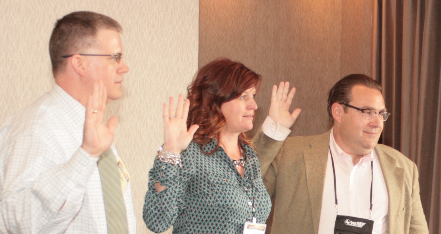 Photo of Dale Picha, Susan Langdon, and Kirk Houser being sworn in.